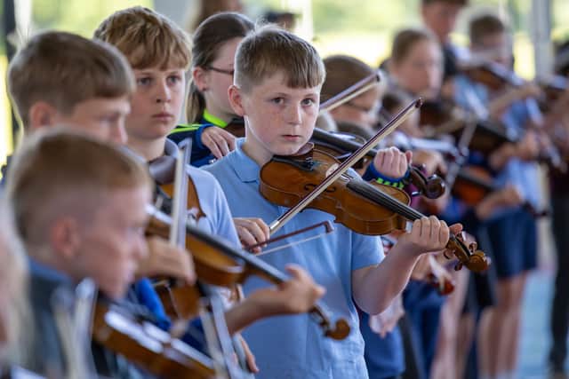 John Davidson of Music Generation Laois teaches violin in Rathdowney each week whhile Irene Ramos of Music Generation Laois teaches violin in Timahoe each week. MORE BELOW PICTURE.