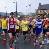 The Ballyliffin International Coastal Challenge donated €10,000 to the Doagh Famine Village fundraiser