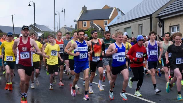 The Ballyliffin International Coastal Challenge donated €10,000 to the Doagh Famine Village fundraiser