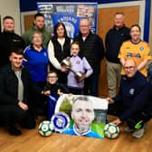 Thomas and Linda Burke with grandchildren Adam and Aoife at the launch of the "Thomas Burke Cup", in memory of their son, organised by Trojans FC.