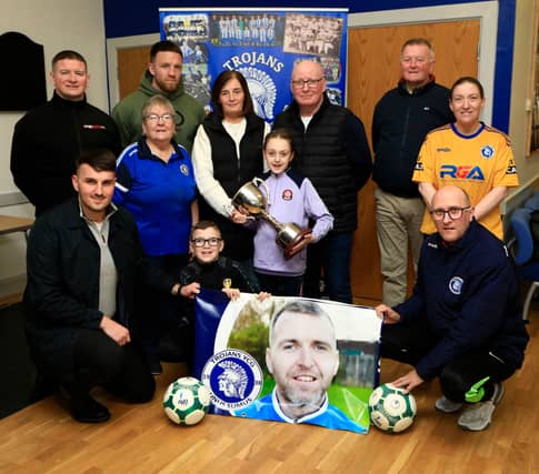 Thomas and Linda Burke with grandchildren Adam and Aoife at the launch of the "Thomas Burke Cup", in memory of their son, organised by Trojans FC.