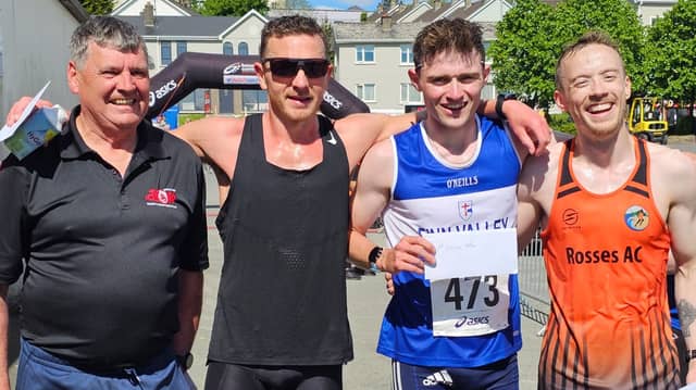 Finn Valley AC's Sean McGinley who won the NW 10k with Danny Mooney (2nd) and Declan Ferry (3rd) and NW10k Chairman Neil Martin. Photos: Geraldine Diver