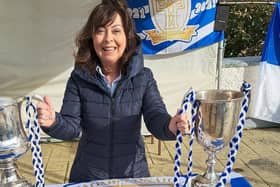 Michelle Cunningham with the Dr Maguire Cup and All-County Football League Division 1 trophy won by Naomh Conaill in 2023. Photo: Naomh Conaill GAA Club