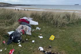 The scene where rubbish was strewn across the beach at Ballyliffin
