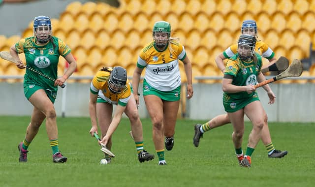 Offaly's Orlagh Phelan and Ellen Regan bring the sliother out of defense with Meath's Aoife Carey and Amy Gaffney closing in to challenge. Ger Rogers Photo