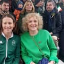 She received a standing ovation from those in the viewing stand as she took her seat with mother Marian Conroy.