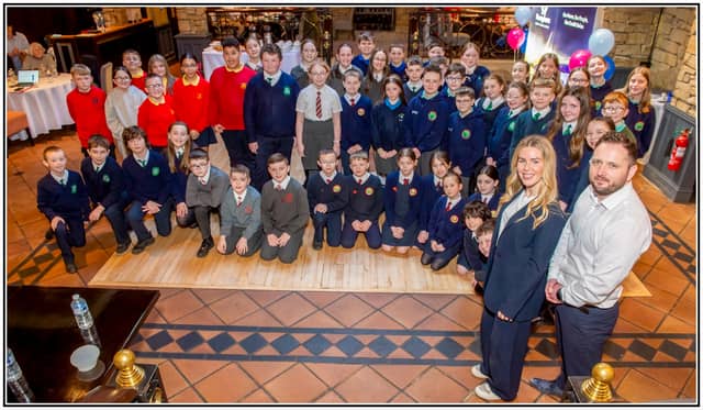 Group Photo pupils with Pennyburn Credit Union manager Frank Doherty and Marketing Executive Laura Brown