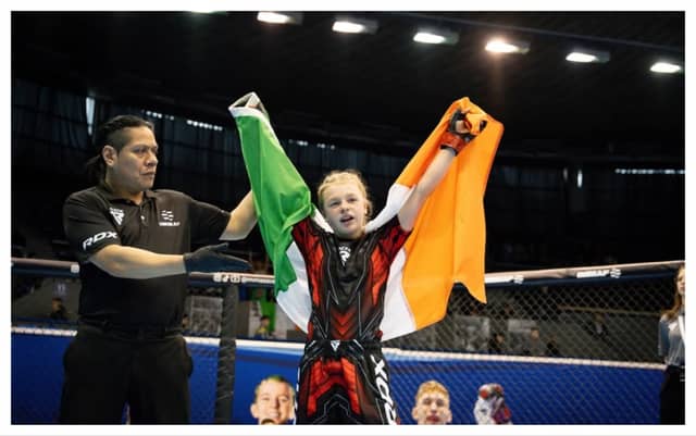 11-year-old Tramore native Freya Marsh celebrating her win at European MMA Championships