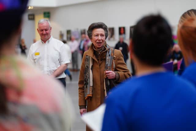 She walked along the critical care corridor of the unit, meeting staff at different intensive care pods while machines could be heard beeping intermittently.