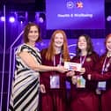Therese Gunning, Legal Director at BT Ireland presents the 3rd place Intermediate Group Health and Wellbeing Category Award to Caoimhe Ryan, Dearbhla Horan and Orlaith Timmons from Presentation Second