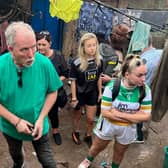 The founder of Hands for Hope School in Kampala, Joe Cummiskey, pictured with some students - the school, which educates children from Manuwongo slum, will benefit from the concert in Buncrana