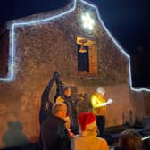 James Scully speaking at the carol singing event in Shannon Harbour. Also in the photo are Sean O'Reilly, Mags Lyons, Tom Devery, Shirley McIntyre. Photo by Dermot McIntyre.