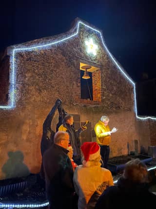 James Scully speaking at the carol singing event in Shannon Harbour. Also in the photo are Sean O'Reilly, Mags Lyons, Tom Devery, Shirley McIntyre. Photo by Dermot McIntyre.