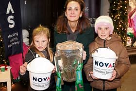 Pictured at laast year's Novas Sleep Out outside Brown Thomas, Dr Una Burns, policy director, Novas with Rosa and Kitty Burns, holding the Liam MacCarthy cup | PICTURE: Adrian Butler