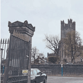 One of a pair of substantial  gates and pillars at the Potato Market