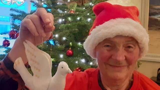 Judith Hinchliff is hanging a dove of peace on her Christmas tree this festive season in solidarity with all those whose lives have been devastated by war