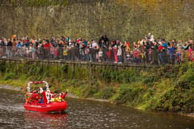 Crowds welcome Santa to Kilkenny as he arrives up the River Nore