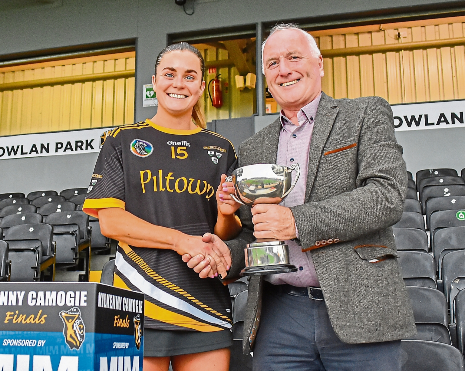 Piltown captain Katie Power is presented with the trophy by Michael Lyng (sponsor)