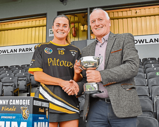Piltown captain Katie Power is presented with the trophy by Michael Lyng (sponsor)