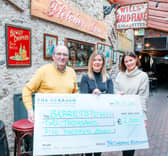 Vincent O'Leary, owner of Fletcher's pub in Naas, Barretstown's Corporate Fundraising Manager Caroline Tobin and Tara Buick from The Curragh Racecourse.