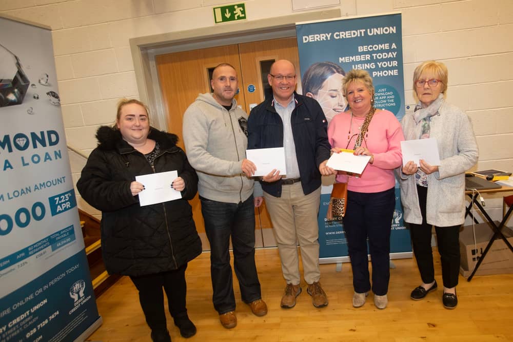 Gerry McMonagle, Derry Credit Union, presenting £25 prizewinners at Monday's AGM. From left Ciara O'Reilly, Sean-Paul Brinkley, Frances Meenan and Grace McKenna.