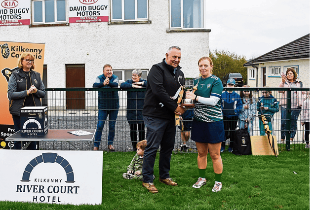 Emeralds captain Siobhan O’Hara is presented with the trophy by Anthony Smith, Rivercourt Hotel. Picture: Billy Culleton