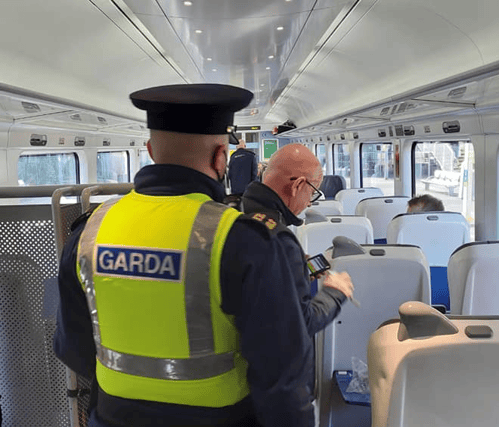 Garda officers in a train carriage / Photo: Kildare Garda Division