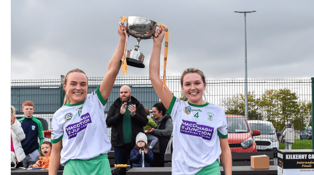 O'Loughlin Gaels captains Laura Murphy and Jen Holohan lift the cup after their side defeated Mooncoin in a tightly fought intermediate final on Saturday. Picture: Billy Culleton