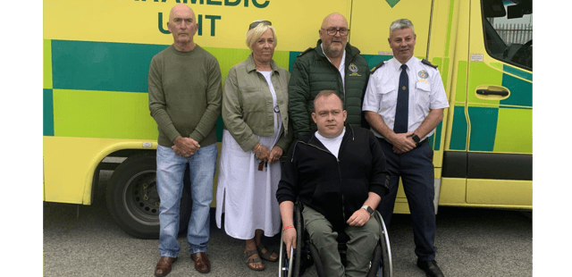 Tom Strappe (standing, second from right) with his brother Joe (left), wife Susan, Ambulance Officer Alan Walsh (right) and son Jamie (front)