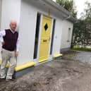 Tom Roche outside his home in Rhode