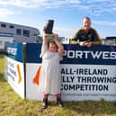 Seamus Mulhare with welly throwers RJ and Grace Burke. Photo: Lynda Kiernan