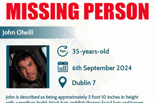 John is described as being approximately 5 foot 10 inches in height with a medium build, black hair, reddish/brown facial hair and brown eyes.