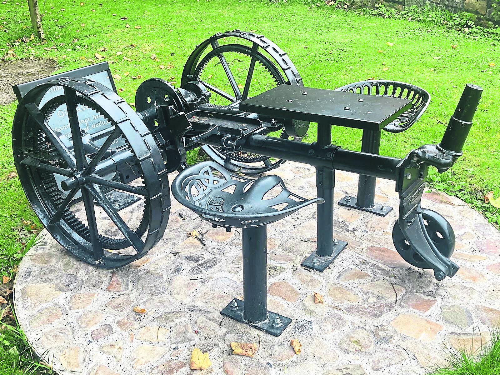 The John Smyth Memorial Seat made from a Pierce horse-drawn finger bar mower at the Forge in Windgap. It was installed by Windgap Tidy Towns and the local  community