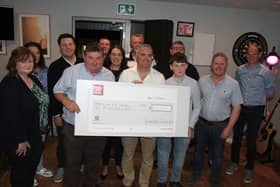 Committee member Brendan Higgins and John Standish (Chairman) presented a cheque for €10,000 to John Leahy and to Michael Dennedy of the “We’re doing it for Dennedy Fund”.