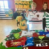 Mary and Imelda Maguire donating their late brother Dermot's jersey collection to Mairead Mulreany of Ardara GAA club. Photo: Clg Ard An Ratha