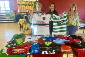 Mary and Imelda Maguire donating their late brother Dermot's jersey collection to Mairead Mulreany of Ardara GAA club. Photo: Clg Ard An Ratha