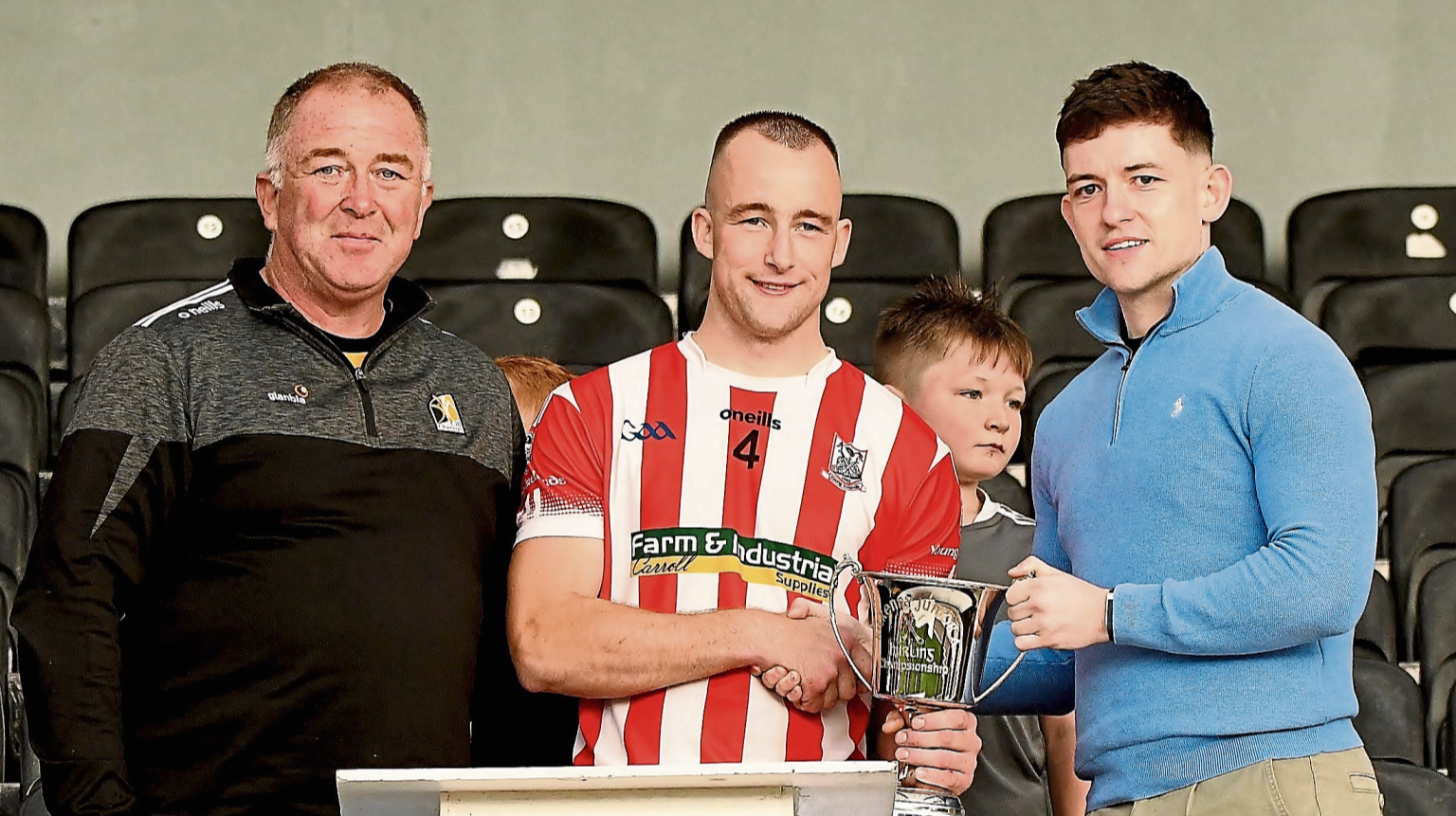 Young Irelands captain Sean Middleton receives the Junior A trophy from Jack Kavanagh, JJ Kavanagh (sponsor) and Pat Cooney, chairman Kilkenny junior board. Picture: Willie Dempsey