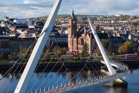 Scenic view of Derry's peace bridge and Guildhall. (IMAGE: Tourism Ireland/Richard Watson)