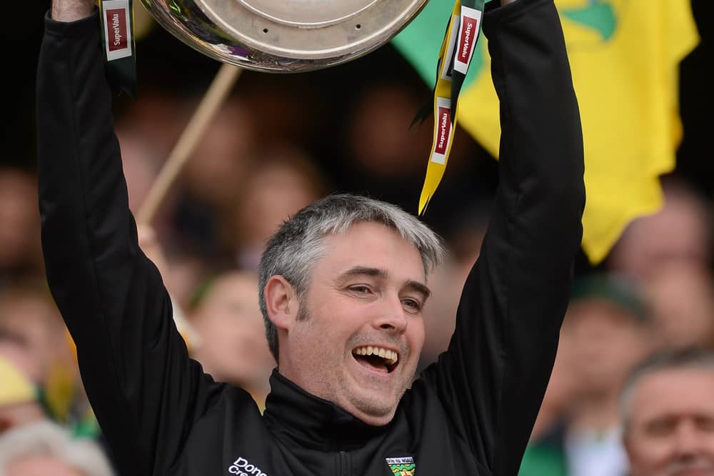 Dr Charlie McManus lifts Sam Maguire at Croke Park in 2012