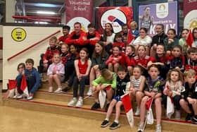 Kelly McGrory being welcomed home by children and athletes from Tír Chonaill AC