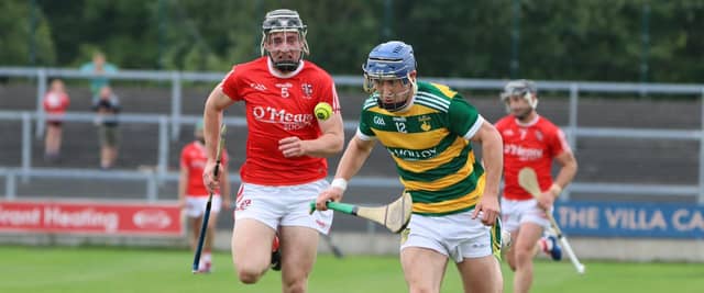 Aaron Maher (Ballimamere) speeds away from Darragh Landy (Shinrone). Picture: Aoife Maher