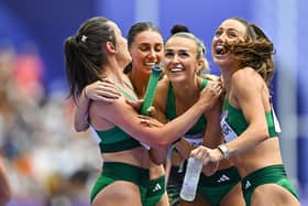 Team Ireland relay team, from left, Phil Healy, Kelly McGrory, Sharlene Mawdsley, and Sophie Becker celebrate after qualifiying for the final in the women's 4 x 400m relay