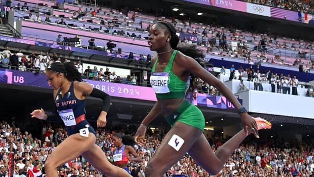 Rhasidat Adeleke of Team Ireland, right, crosses the finish line to finish fourth in the women's 400m final at the Stade de France during the 2024 Paris Summer Olympic Games last night