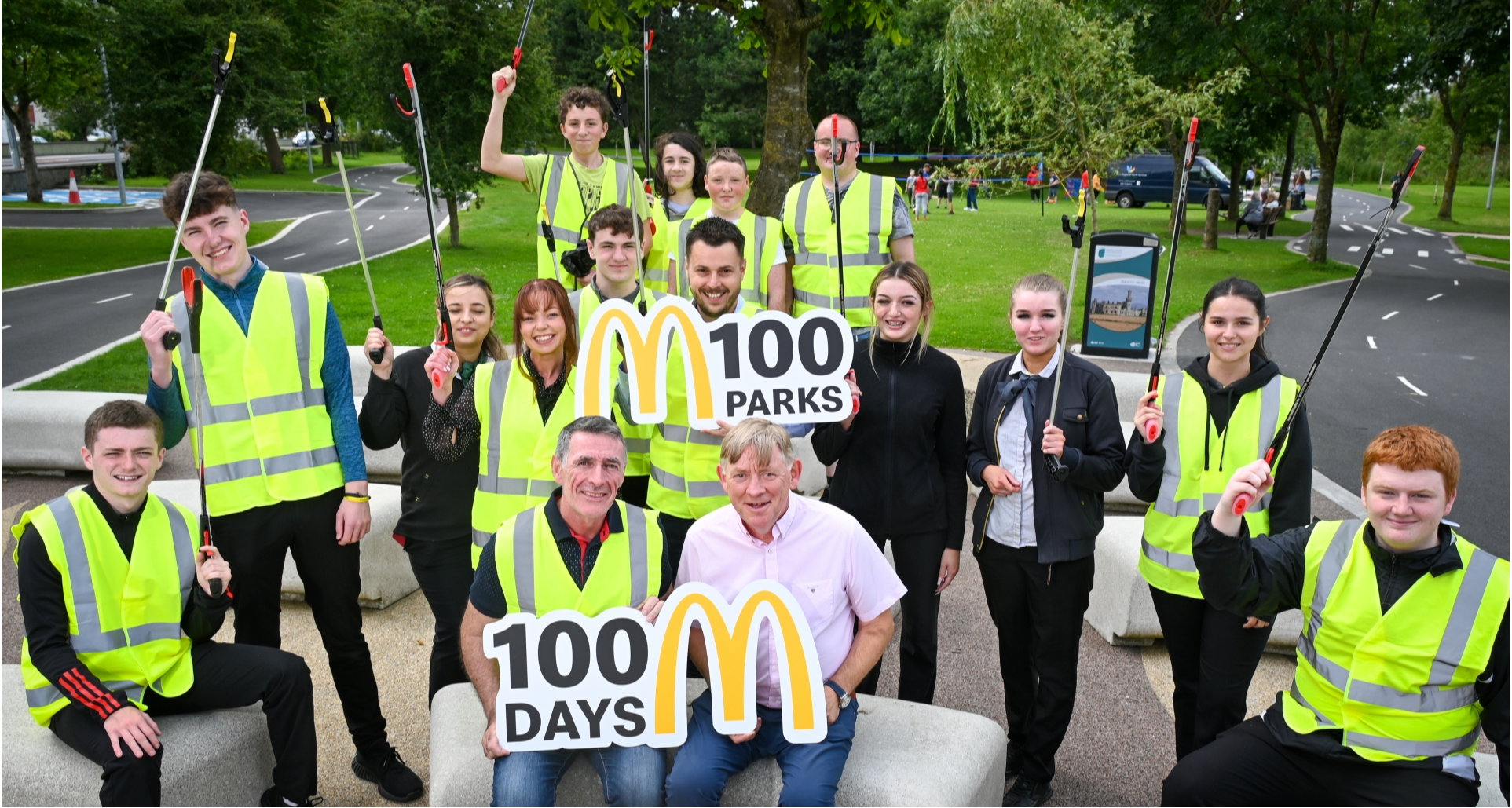 (L-R): Councillor Paul Doogue & McDonald’s Franchisee Bernard Byrne. Centre, holding sign: McDonald’s Operations Manager Manuel Jean