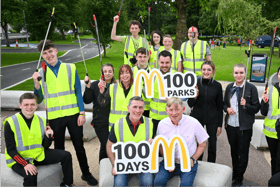 (L-R): Councillor Paul Doogue & McDonald’s Franchisee Bernard Byrne. Centre, holding sign: McDonald’s Operations Manager Manuel Jean