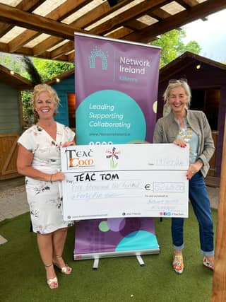 Anne Healy, President of Network Ireland Kilkenny, presenting Angela Hayes, founder of Teac Tom, with a cheque for €5,240 on behalf of the Network's members