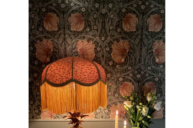 For vintage-inspired, retro pieces, she says to search for tactile fabrics, richly upholstered furniture, walnut-finish tables or rustic wood décor.