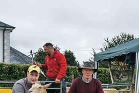 Gyll Condon and his dad David with the winning ram