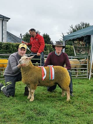 Gyll Condon and his dad David with the winning ram