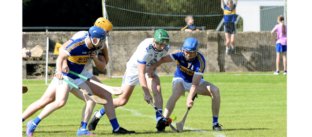 Sean Hickey, Sean Treacys (right) and Niall Hoctor of St Mary's in a scrap for possession. Picture: Michael Boland